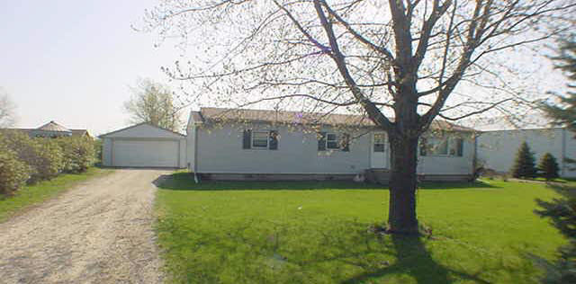 6465 Junction Road Davis Junction, IL 61020 - Photo 1 of 6 a backyard of a house with yard and tree
