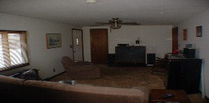 6465 Junction Road Davis Junction, IL 61020 - Photo 2 of 6 a living room with furniture and a flat screen tv