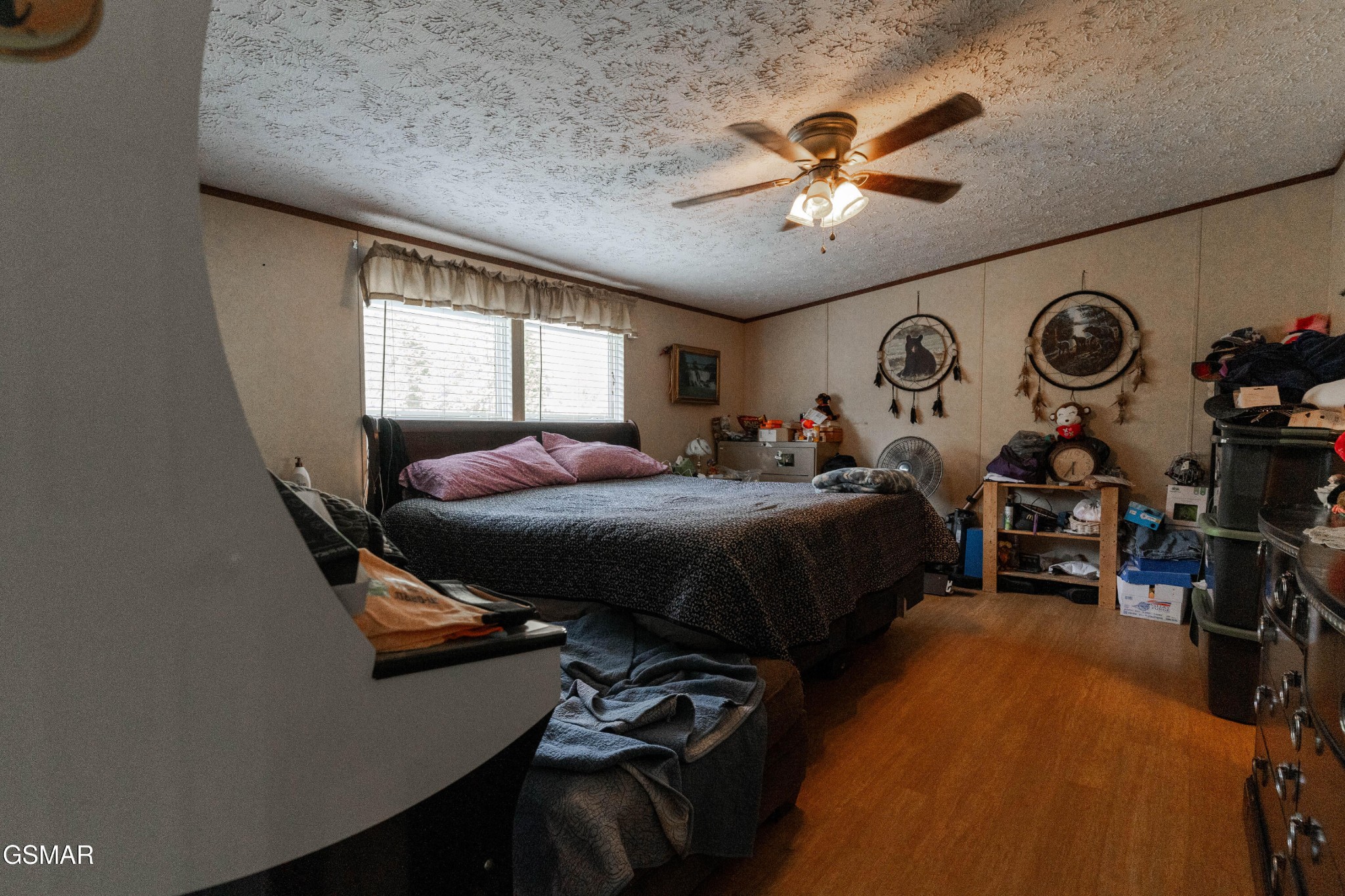 275 Crowder Road Madisonville, TN 37354 - Photo 5 of 21 a bed room with a bed and a ceiling fan