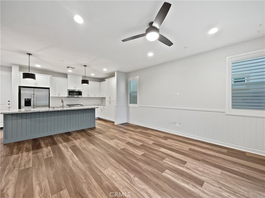 38352 Windingwalk Drive Murrieta, CA 92563 - Photo 12 of 28 a large kitchen with kitchen island a counter space a sink and appliances