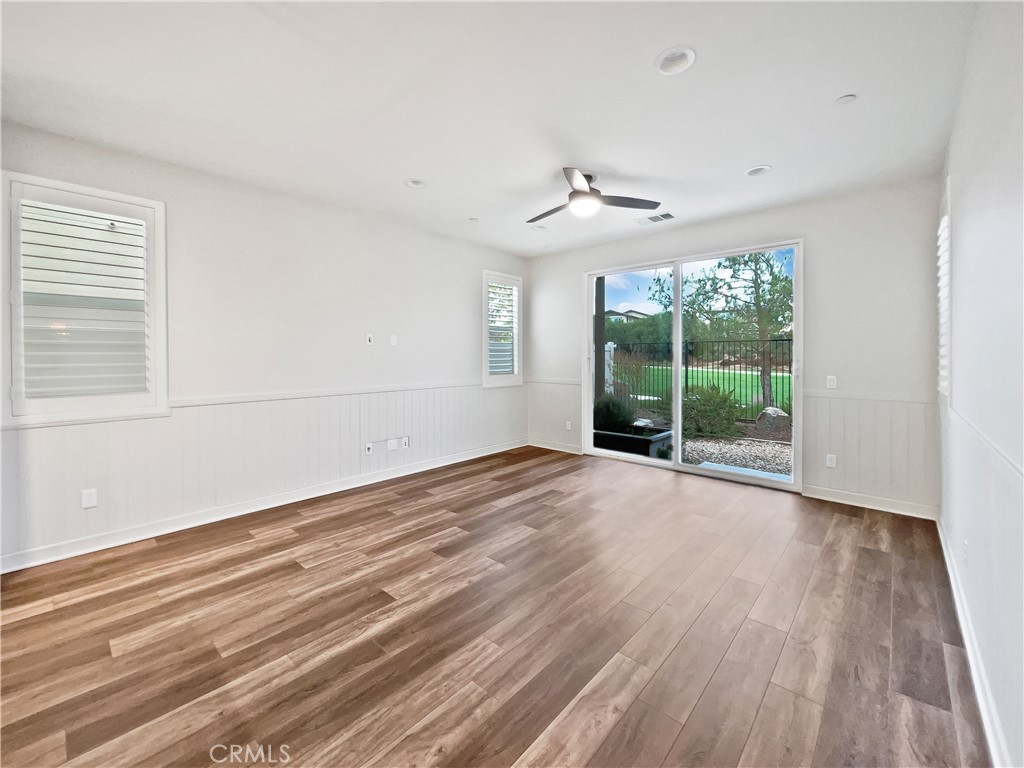 38352 Windingwalk Drive Murrieta, CA 92563 - Photo 16 of 28 a view of an empty room with wooden floor and a window