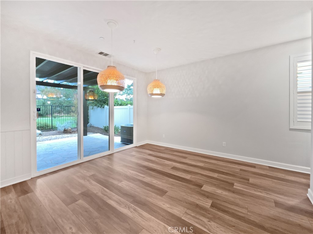 38352 Windingwalk Drive Murrieta, CA 92563 - Photo 3 of 28 a view of a livingroom with wooden floor and window