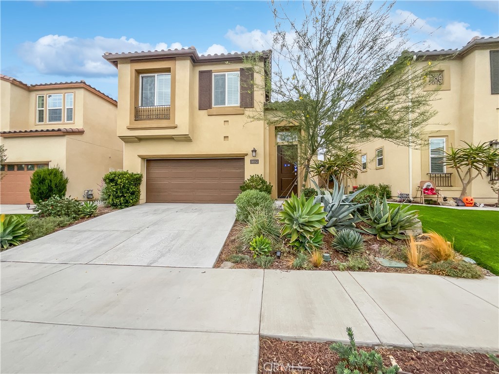38352 Windingwalk Drive Murrieta, CA 92563 - Photo 10 of 28 a front view of a house with garden