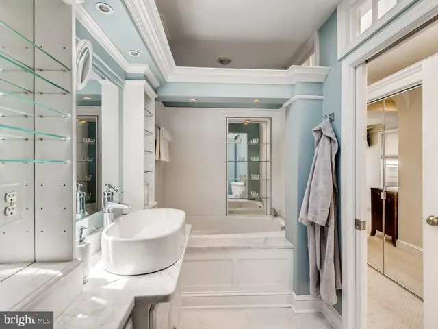 a bathroom with a sink and mirror