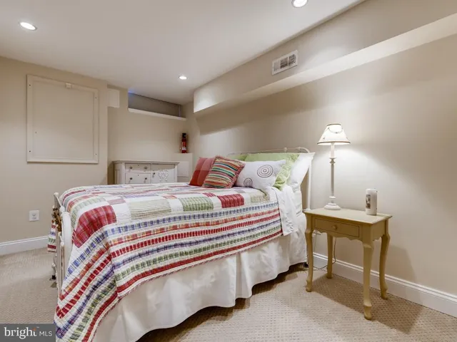 a bedroom with a bed and a table