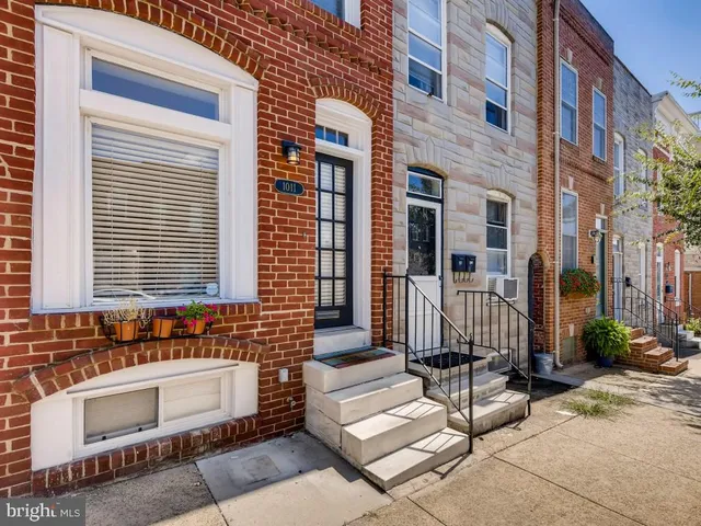a view of a brick buildings with many windows