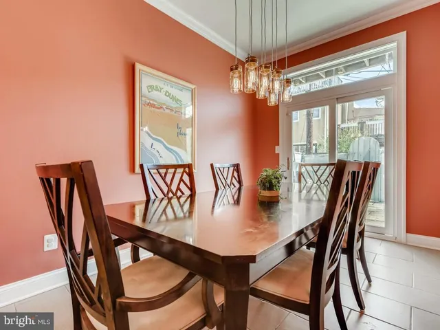 a view of a dining room with furniture window and chandelier
