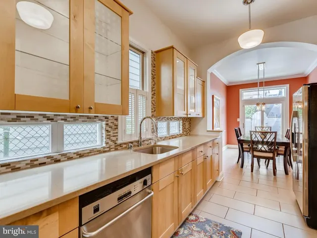 a kitchen with lots of counter space and dining table