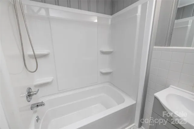 a bathroom with a bath tub