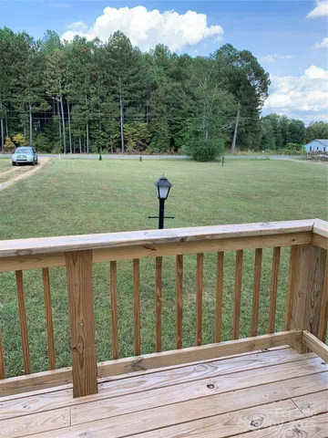 a view of a deck with a yard