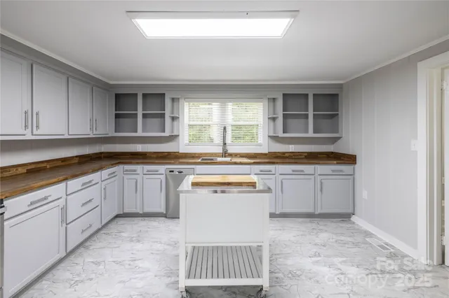 a kitchen with a sink stove and cabinets