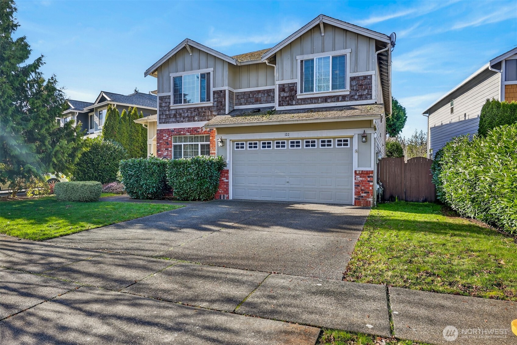 122 185th Place Southwest Bothell, WA 98012 - Photo 2 of 39 a front view of a house with a yard and garage