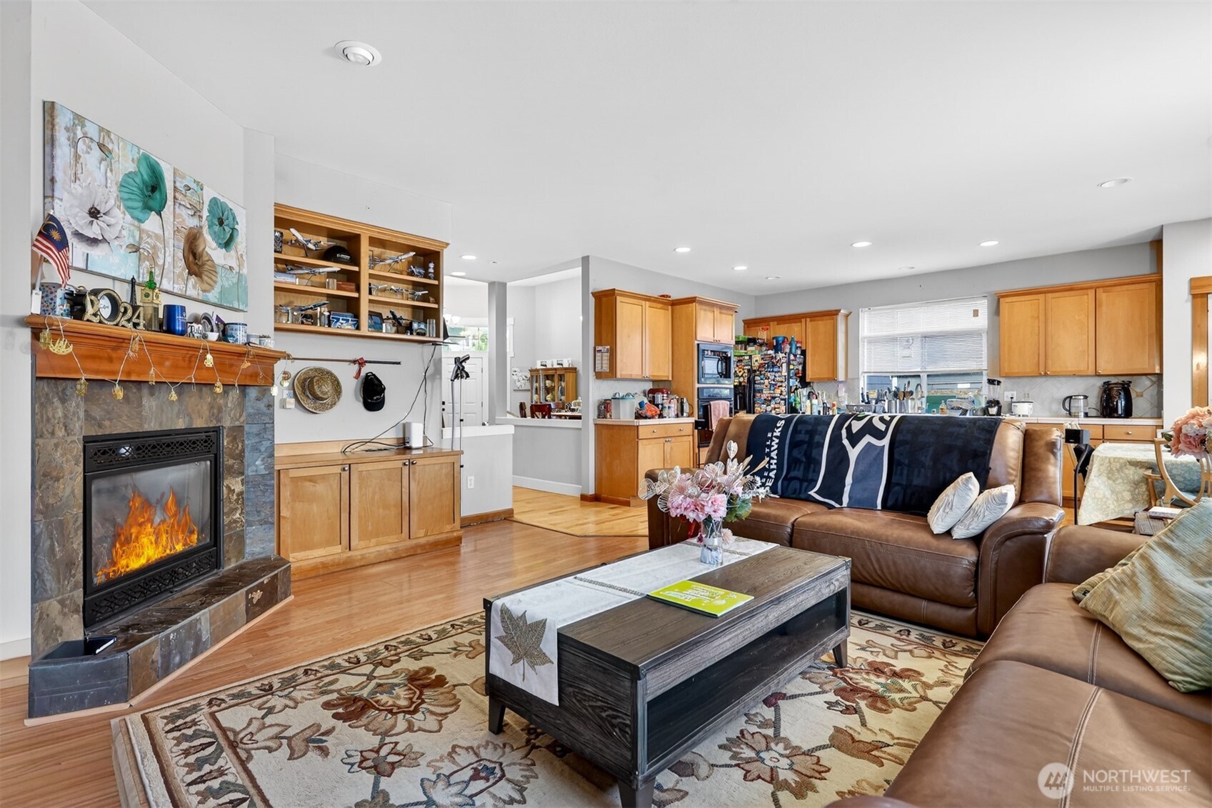 122 185th Place Southwest Bothell, WA 98012 - Photo 21 of 39 a living room with furniture and a fireplace