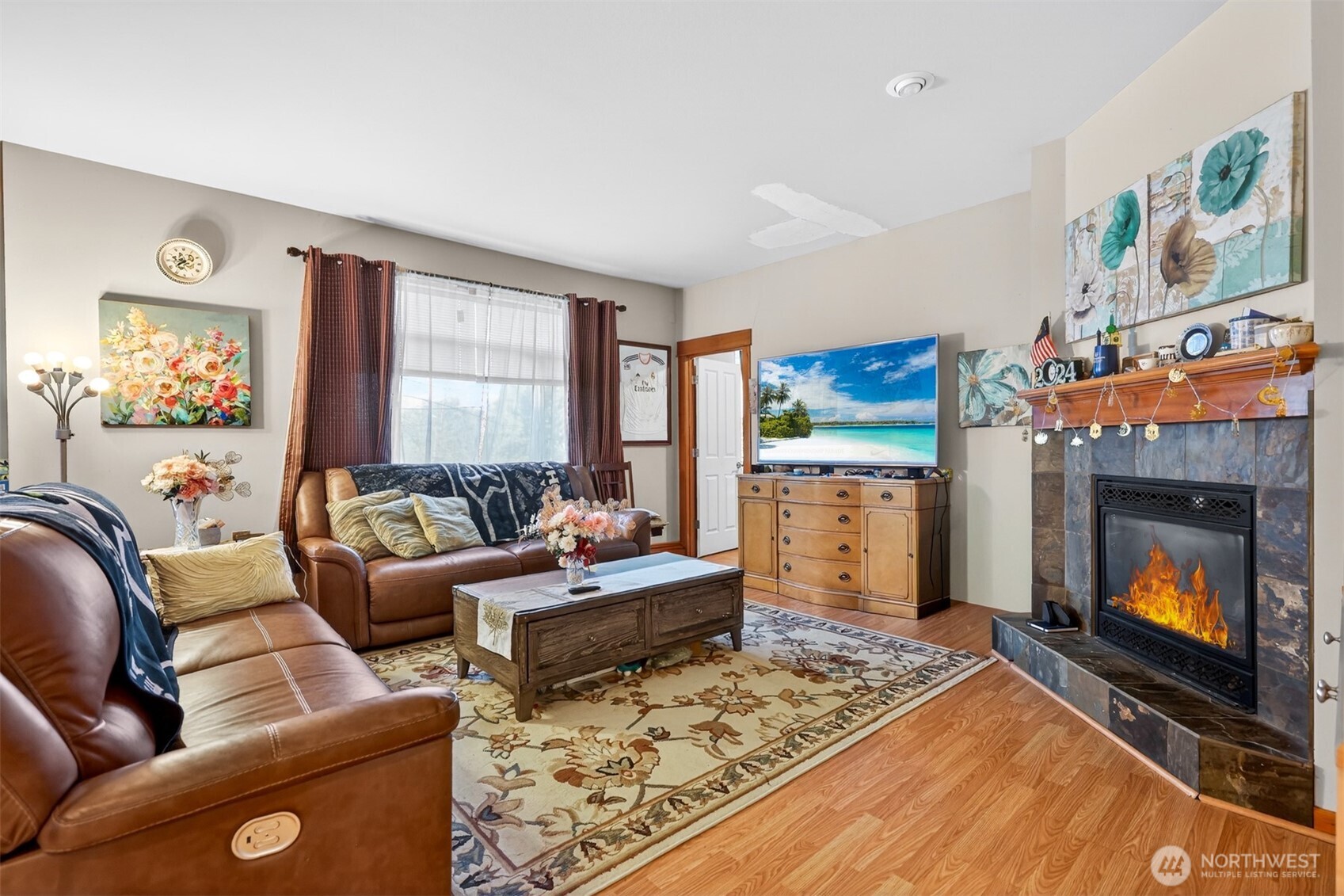 122 185th Place Southwest Bothell, WA 98012 - Photo 23 of 39 a living room with furniture and a fireplace