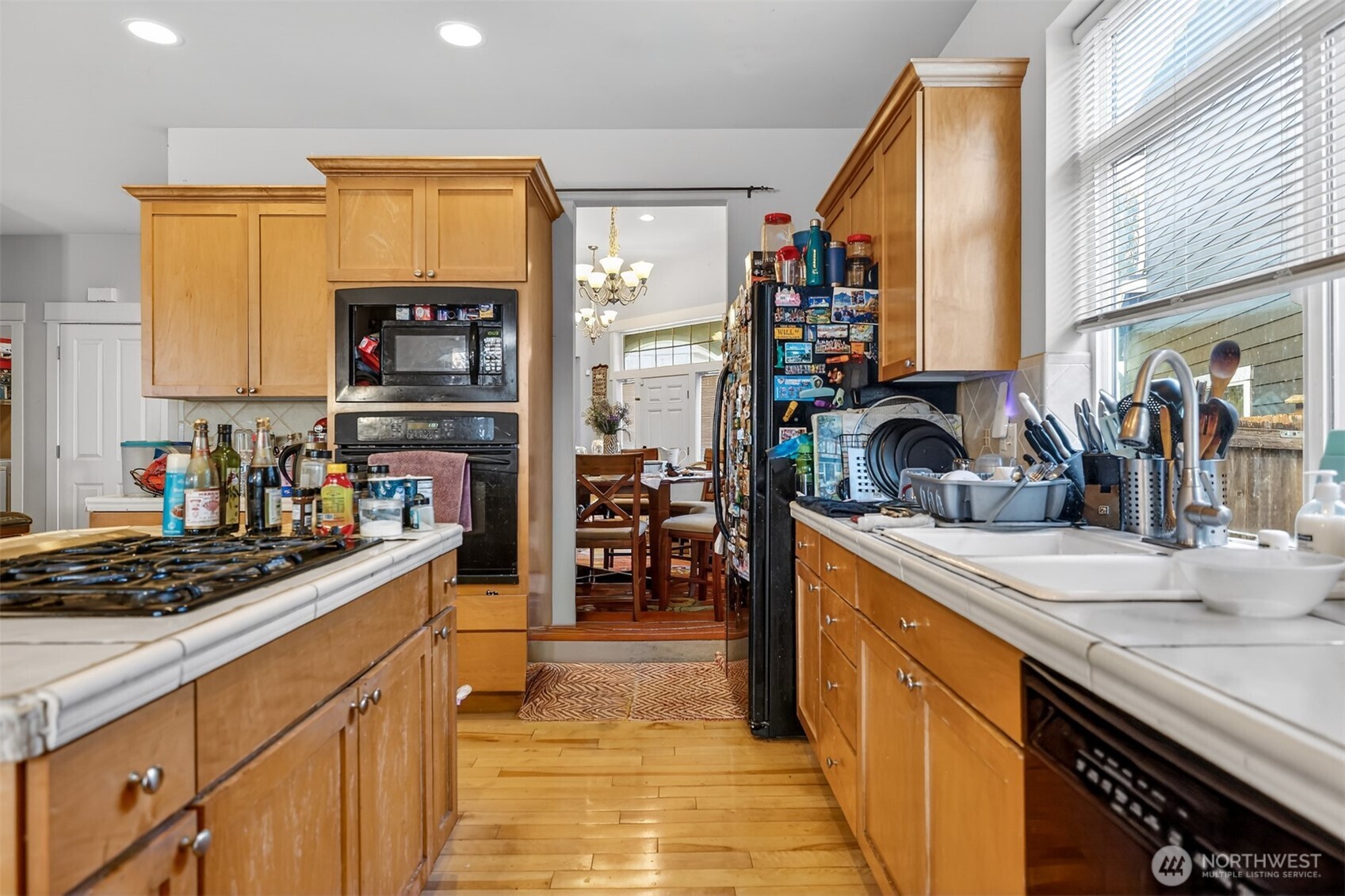 122 185th Place Southwest Bothell, WA 98012 - Photo 27 of 39 a kitchen with stainless steel appliances a sink stove and a window