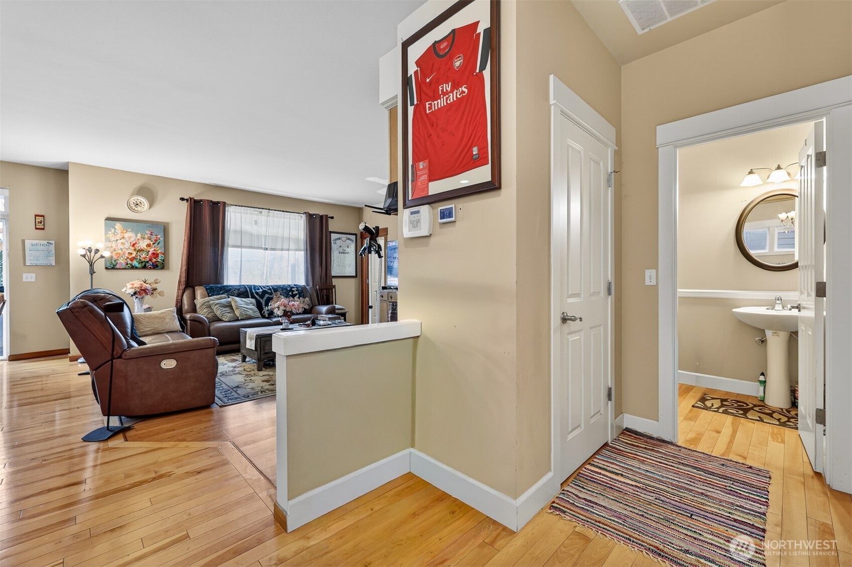 122 185th Place Southwest Bothell, WA 98012 - Photo 28 of 39 a living room with furniture a flat screen tv and a fireplace