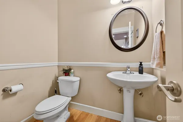 a bathroom with a sink a mirror and a toilet