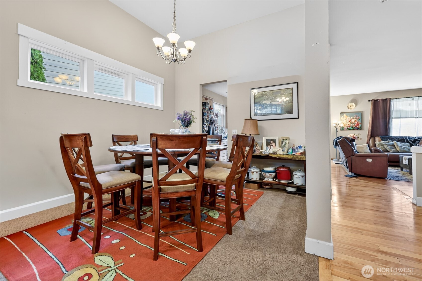 122 185th Place Southwest Bothell, WA 98012 - Photo 32 of 39 a view of a dining room with furniture and a chandelier