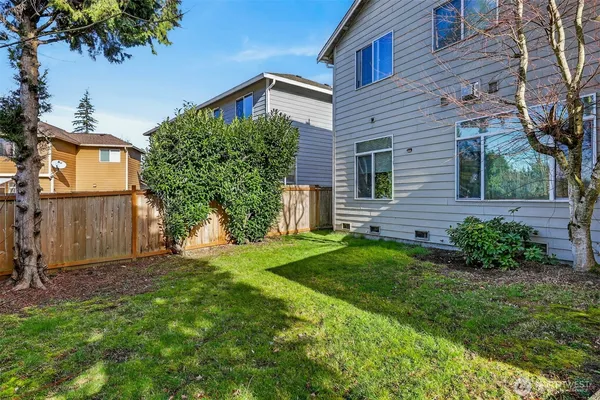 a view of a house with a yard and plants