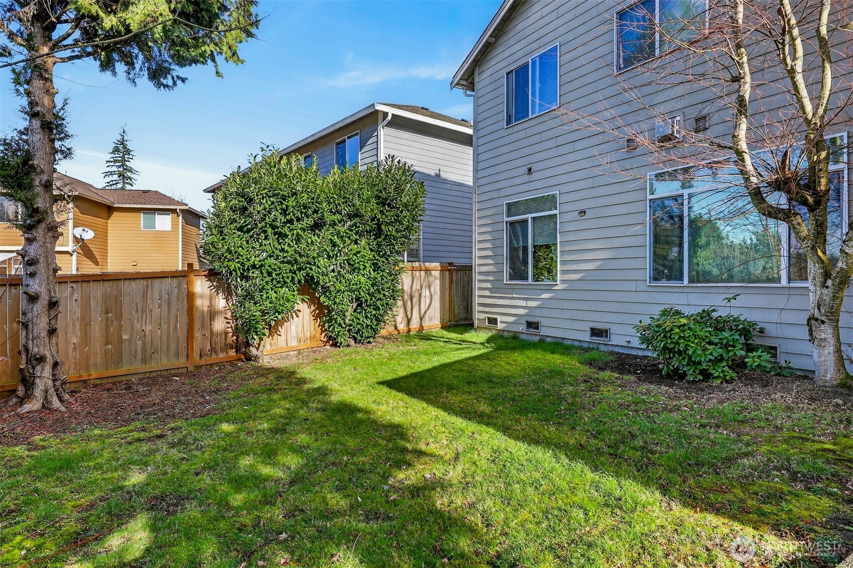 122 185th Place Southwest Bothell, WA 98012 - Photo 5 of 39 a view of a house with a yard and plants