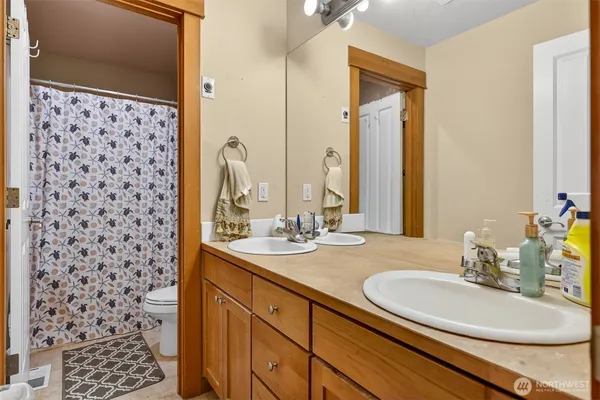 a bathroom with a sink a vanity and a mirror