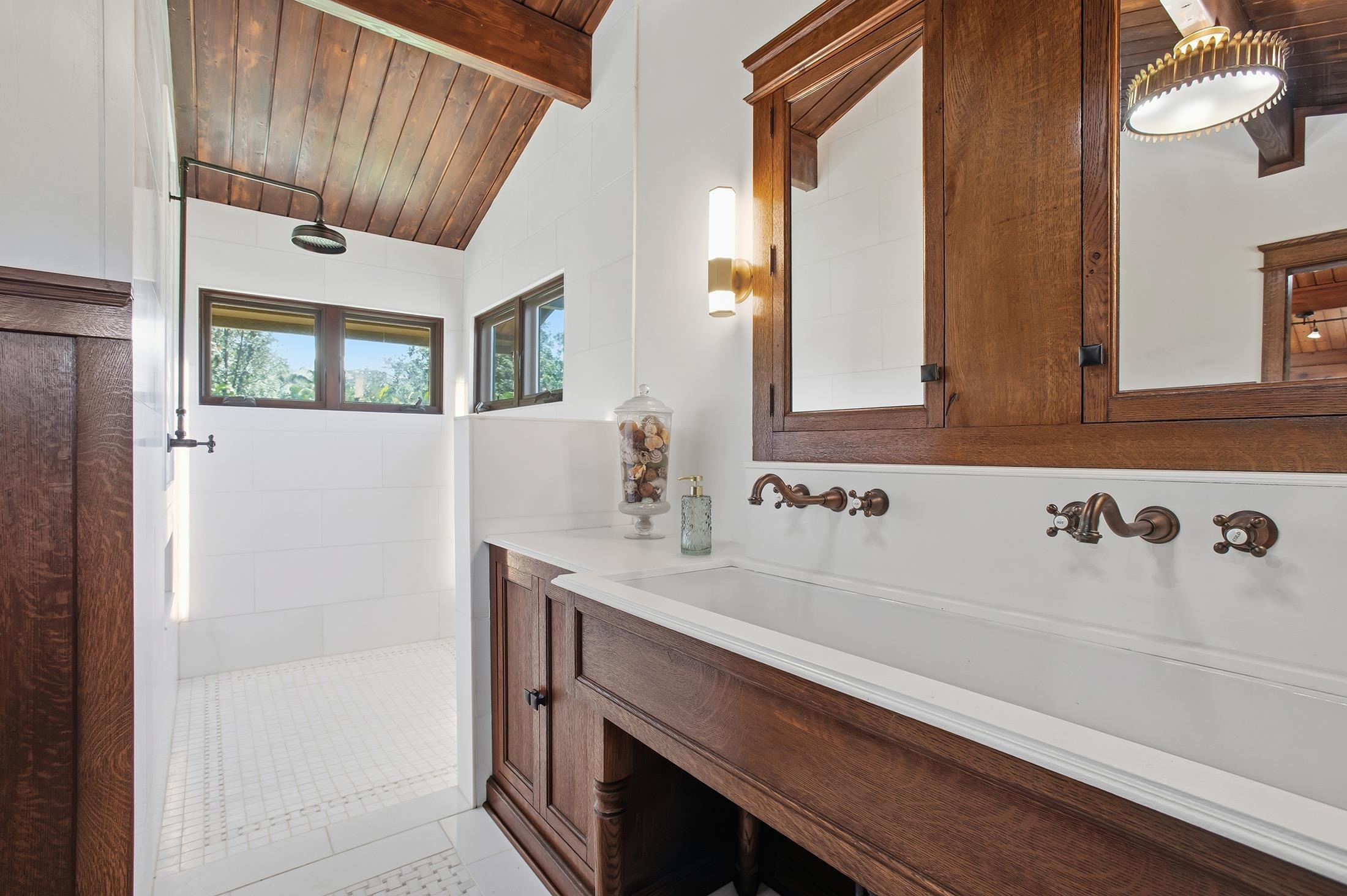 30 Mamao Place Haiku, HI 96708 - Photo 25 of 50 a bathroom with a sink and a mirror