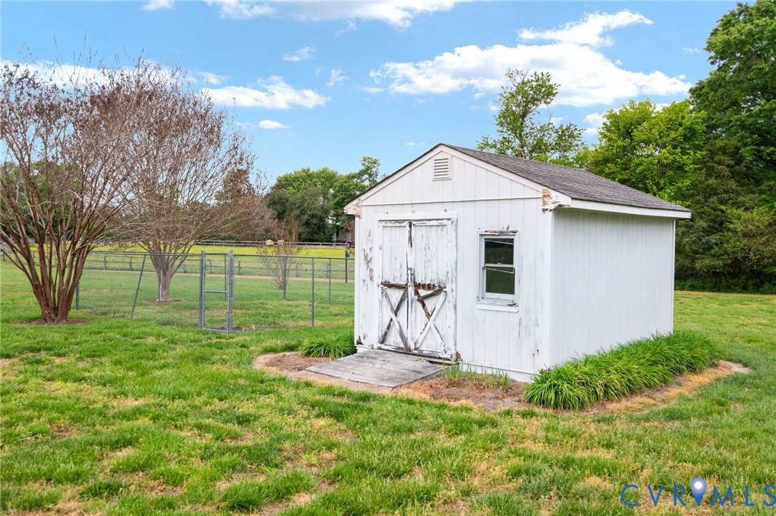 16379 Arch Hill Road Hanover, VA 23069 - Photo 22 of 26 a view of a house with backyard and a tree