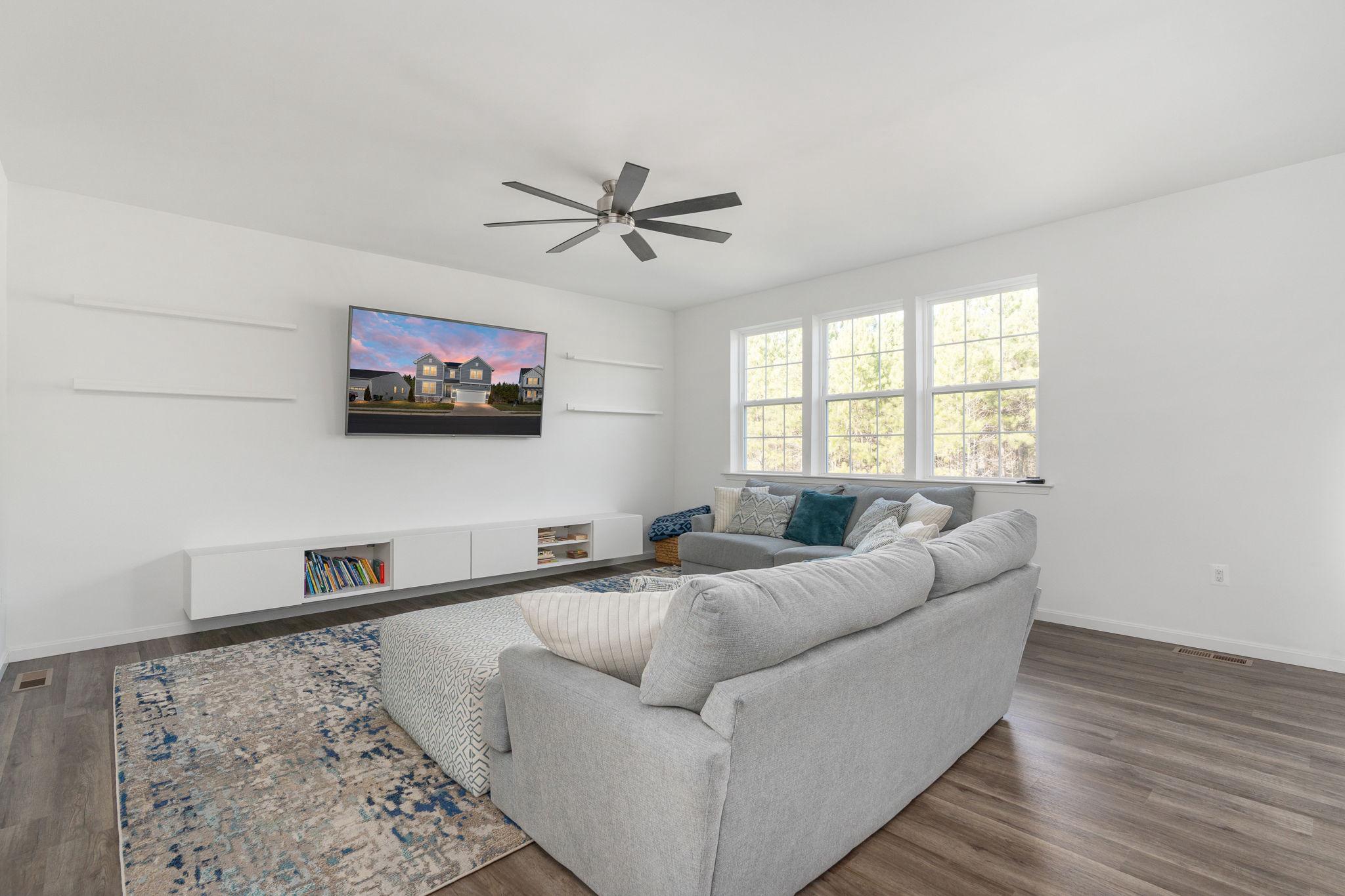 6371 Pointer Lane King George, VA 22485 - Photo 7 of 38 a living room with furniture and a flat screen tv