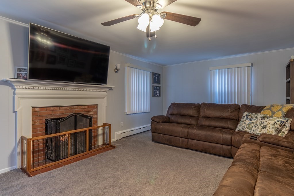 45 Baird Street Fall River, MA 02721 - Photo 17 of 42 a living room with furniture fireplace and flat screen tv