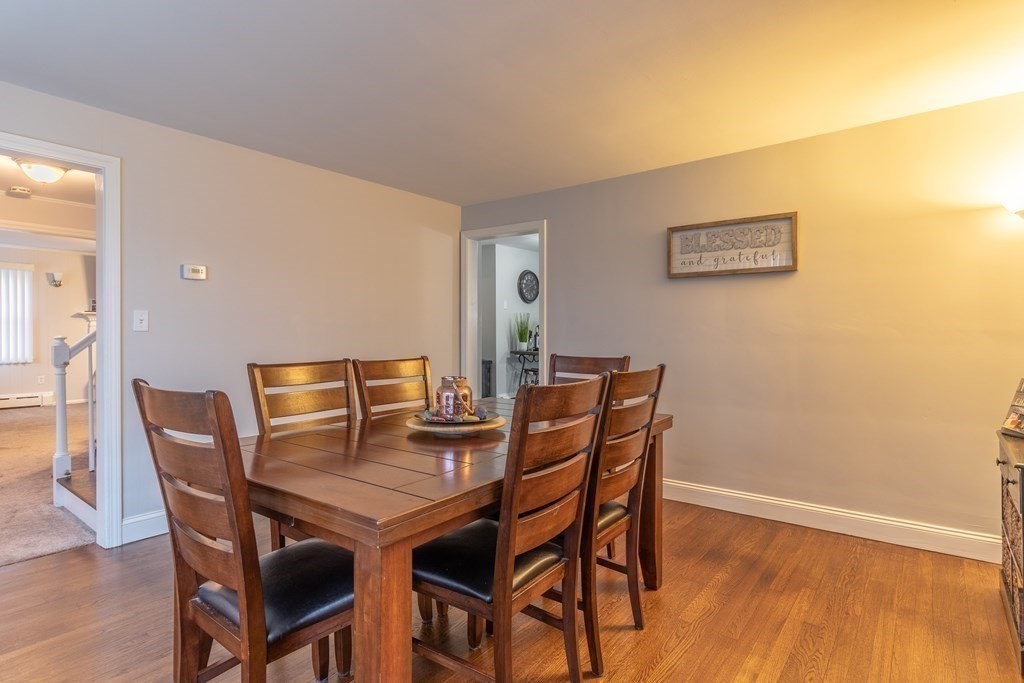 45 Baird Street Fall River, MA 02721 - Photo 19 of 42 a view of a dining room with furniture and wooden floor