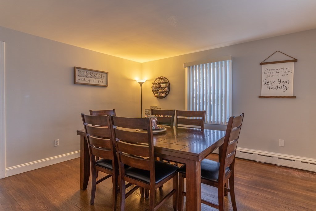 45 Baird Street Fall River, MA 02721 - Photo 20 of 42 a view of a dining room with furniture and wooden floor