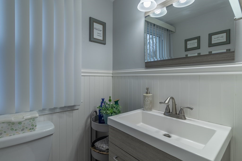 45 Baird Street Fall River, MA 02721 - Photo 23 of 42 a bathroom with a sink a mirror and vanity