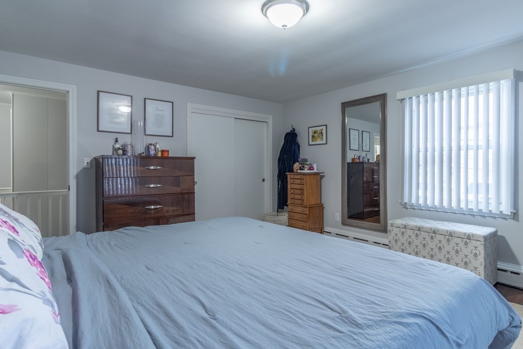 45 Baird Street Fall River, MA 02721 - Photo 25 of 42 a bedroom with a bed and cabinet