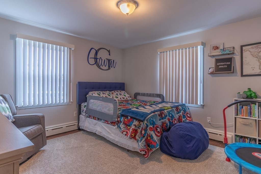 45 Baird Street Fall River, MA 02721 - Photo 29 of 42 a bedroom with a bed and a couch