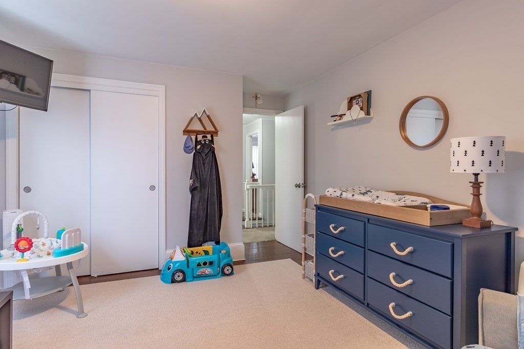 45 Baird Street Fall River, MA 02721 - Photo 33 of 42 a bed room with a bed and a dresser