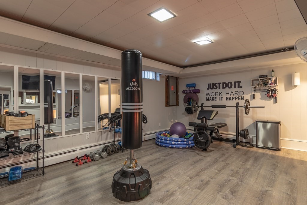 45 Baird Street Fall River, MA 02721 - Photo 38 of 42 a room with gym equipment and a large window