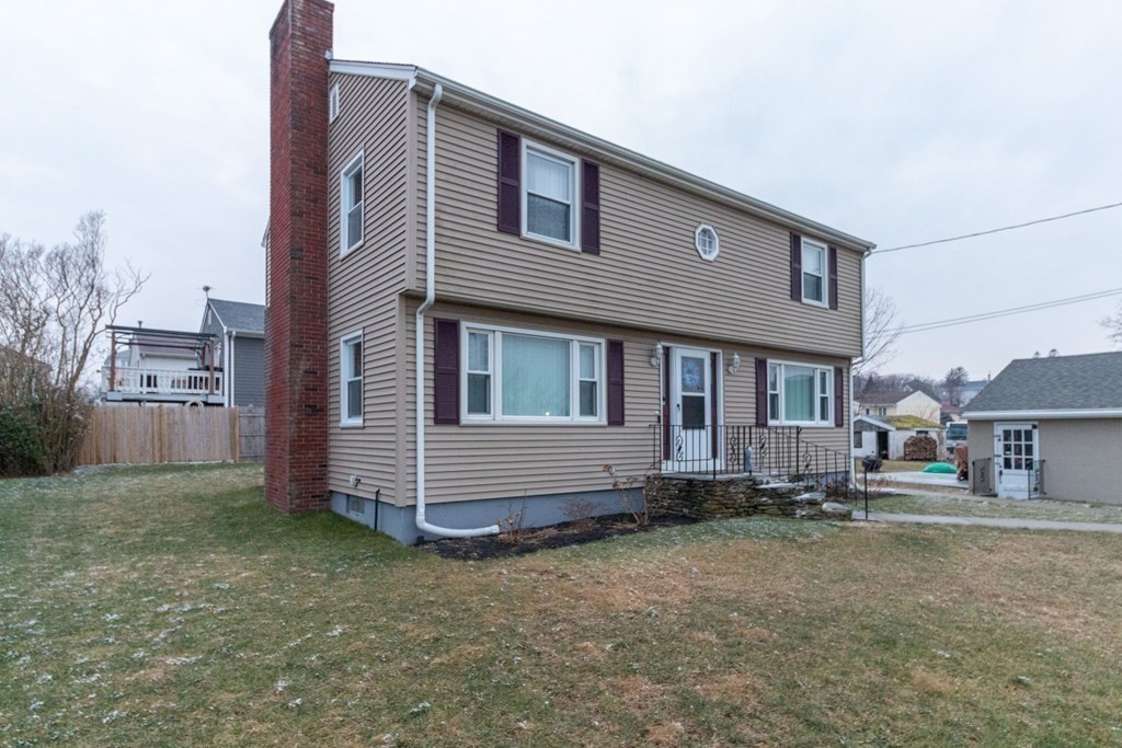 45 Baird Street Fall River, MA 02721 - Photo 4 of 42 a brick house that has a lots of windows in it