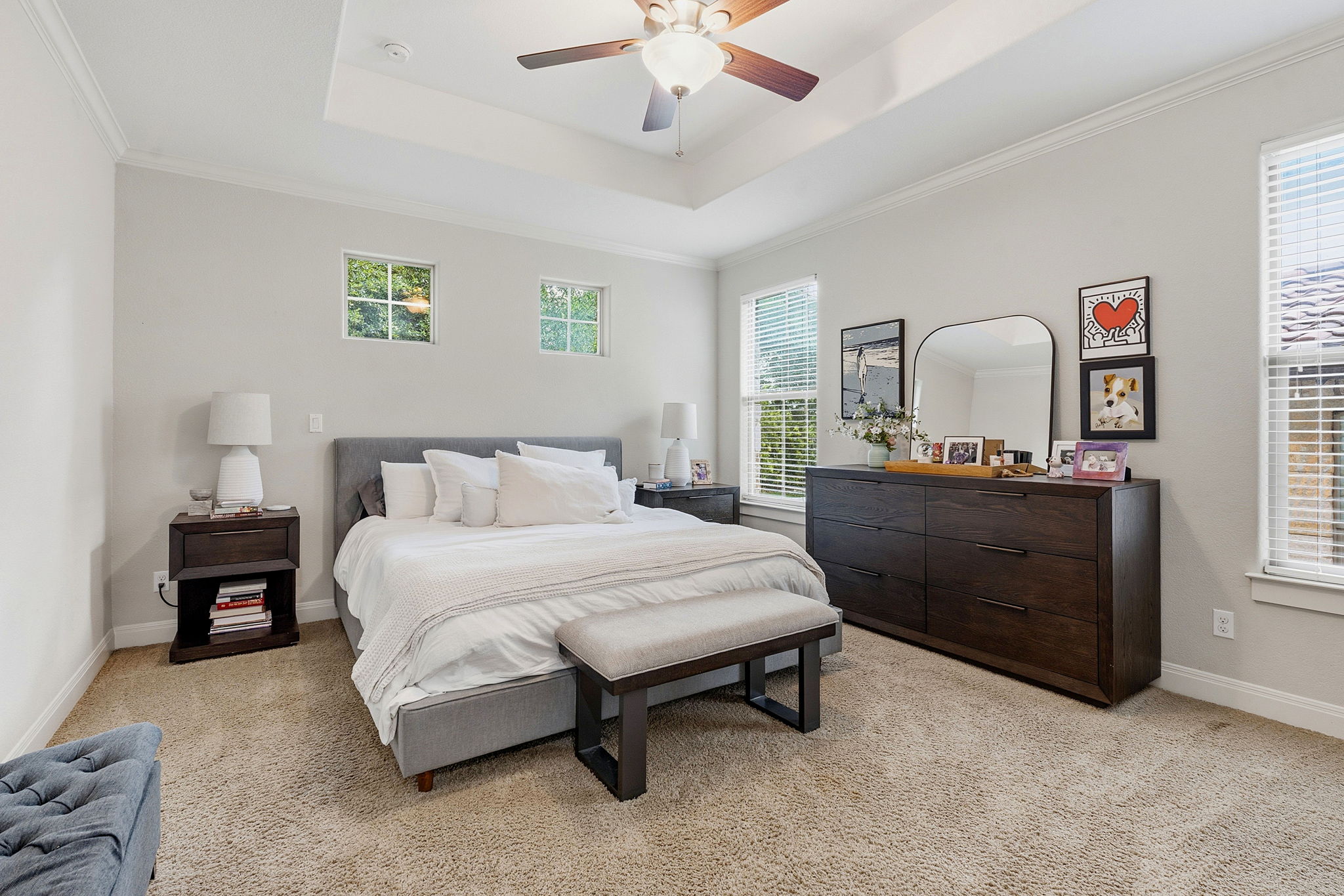 15317 Falconhead Grove Loop Austin, TX 78738 - Photo 4 of 36 Spacious bedroom featuring a tray ceiling, recessed lighting, and a ceiling fan