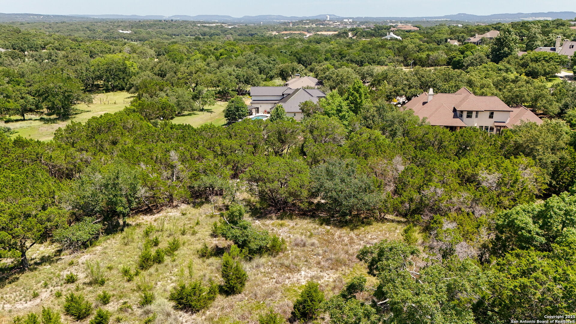 116 Balcones Bend Boerne, TX 78006 - Photo 17 of 25 an aerial view of residential house with parking space and trees