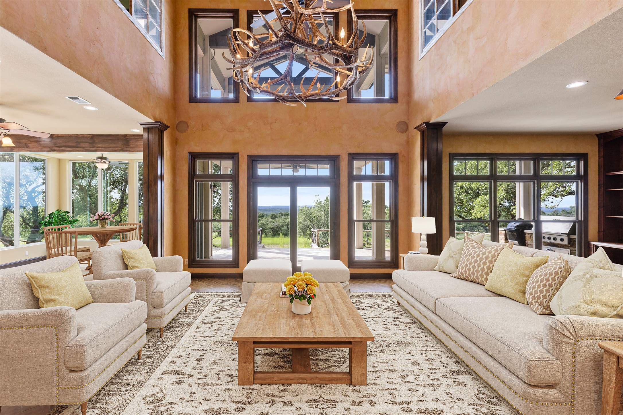 3149 Byrd Ranch Road Johnson City, TX 78636 - Photo 4 of 39 Living room featuring ornate columns, recessed lighting, plenty of natural light, and a towering ceiling