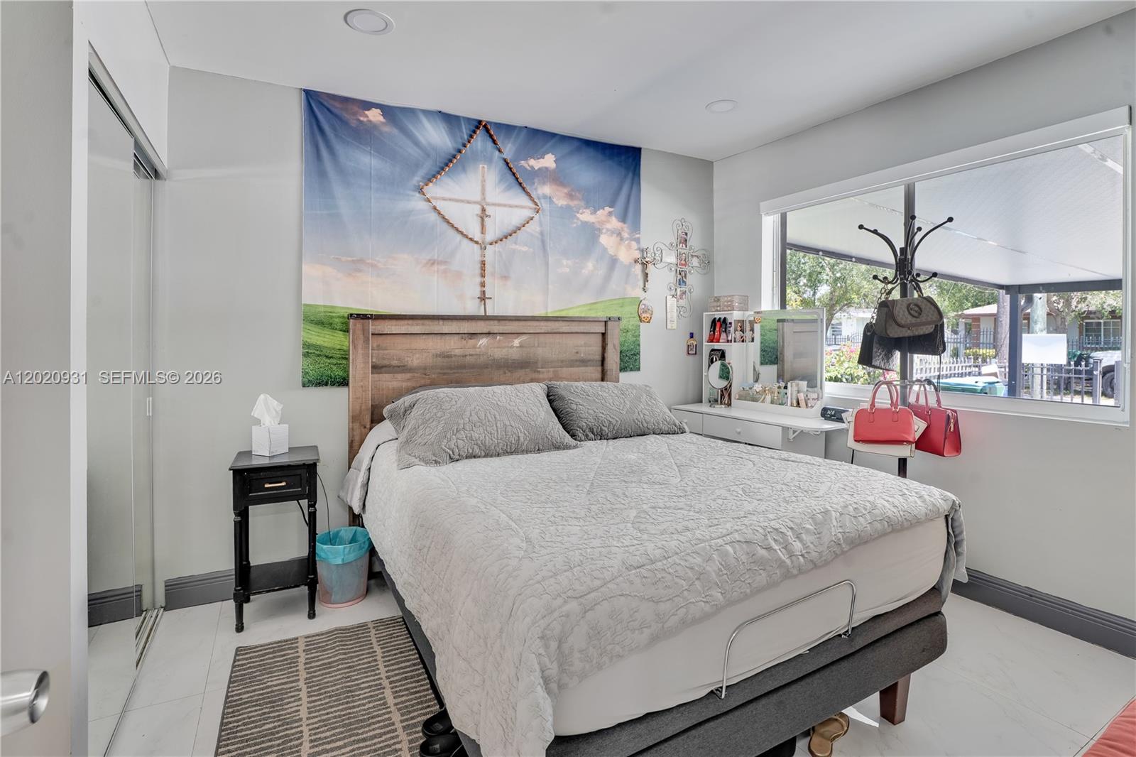 1360 Northwest 77th Street Miami, FL 33147 - Photo 19 of 41 a bedroom with bed and window