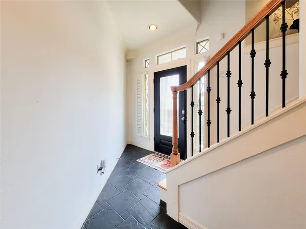 a view of balcony with furniture
