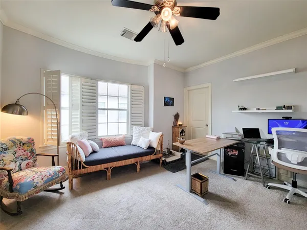 an empty room with wooden floor fireplace and windows
