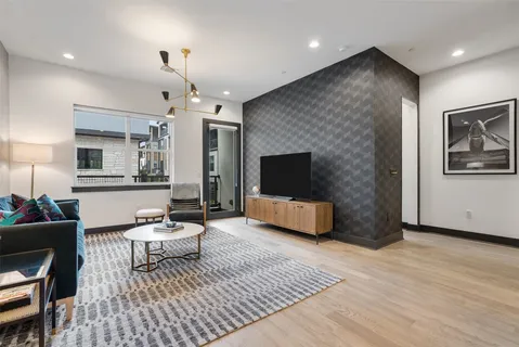 a kitchen with stainless steel appliances granite countertop a sink and a refrigerator
