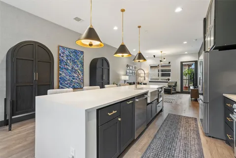 a spacious bedroom with a bed couch and a large window