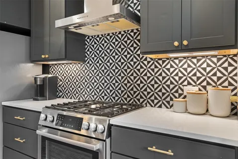 a bathroom with double sink and a mirror