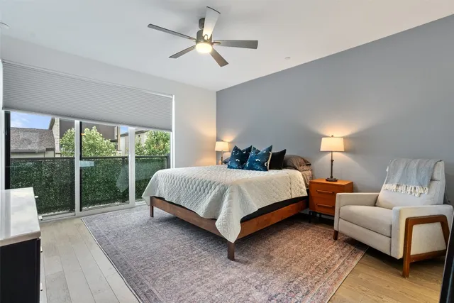 a view of a hallway view with wooden floor and staircase