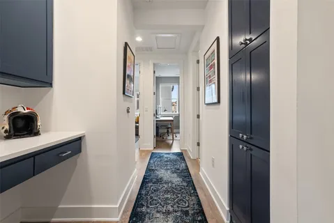 a bedroom with two beds and a dresser