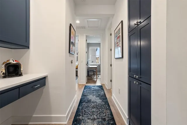 a bedroom with two beds and a dresser