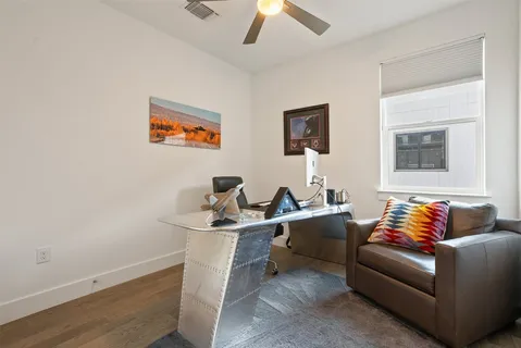 a view of a swimming pool with a garden and trees